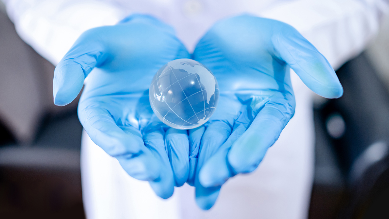 world in gloved hands.jpg
